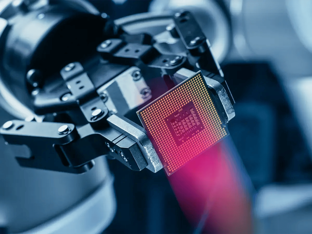 A robotic arm delicately holds a microchip, showcasing precision technology