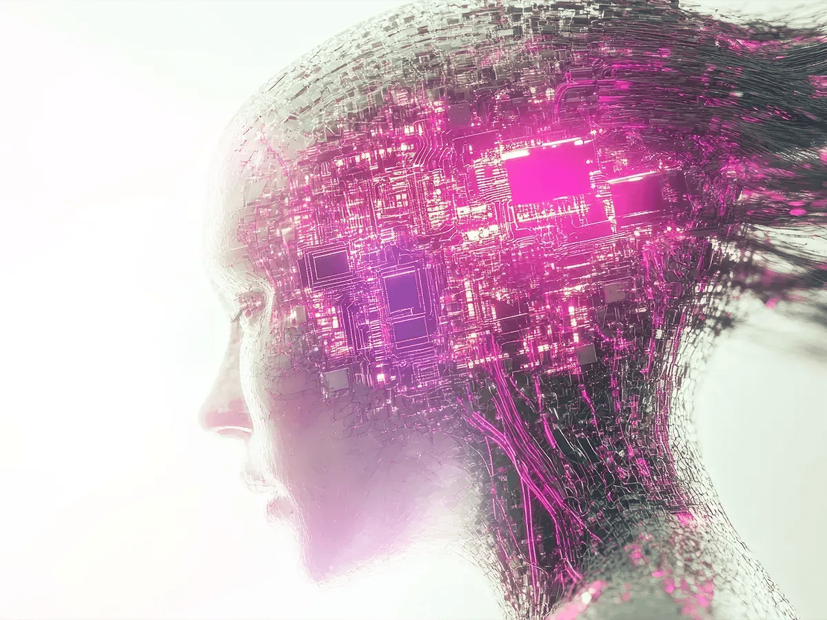 Side profile of a human head with digital circuits and glowing pink technology integrated into it