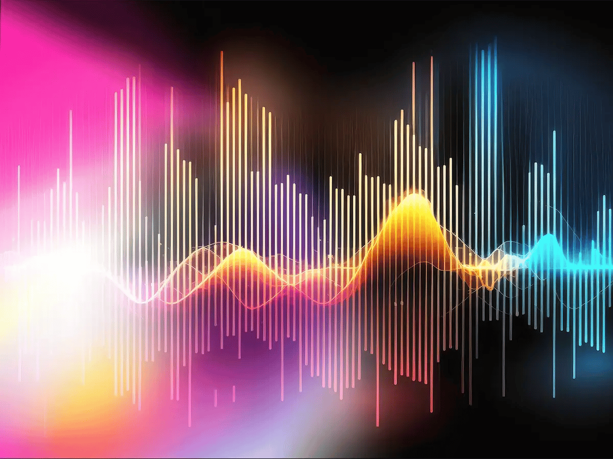Vibrant soundwave graphic with colorful vertical bars and waves in pink, orange, and blue on a dark background